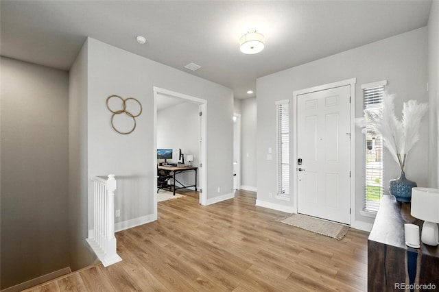18212 W 95th Pl, Arvada, CO 80007 - entrance foyer featuring light wood finished floors and baseboards