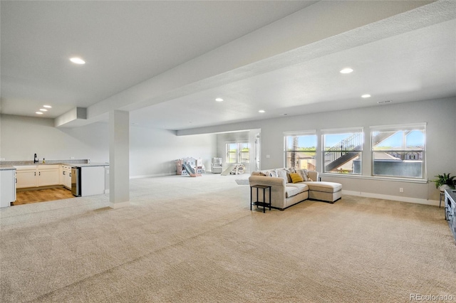18212 W 95th Pl, Arvada, CO 80007 - living area featuring light carpet, recessed lighting, and baseboards