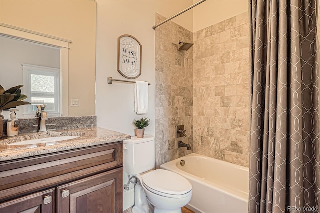 full bath with toilet, shower / bath combo, and vanity