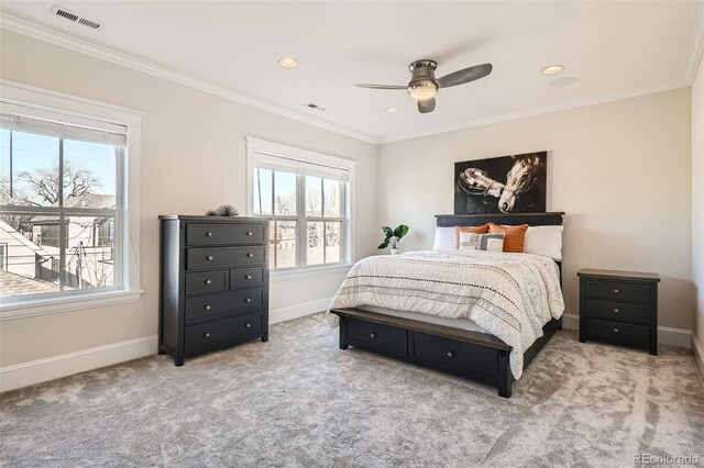 carpeted bedroom featuring baseboards, visible vents, crown molding, and recessed lighting