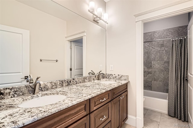 bathroom featuring double vanity, shower / bath combo with shower curtain, a sink, and tile patterned floors