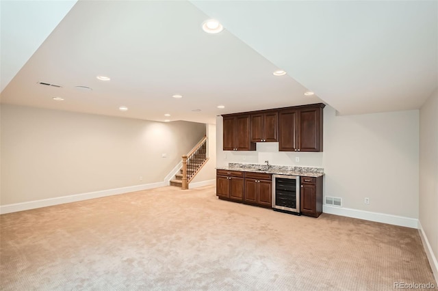 bar with wine cooler, recessed lighting, stairway, light carpet, and baseboards