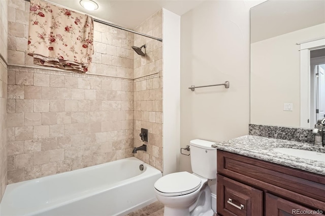 bathroom featuring shower / bathing tub combination, vanity, and toilet