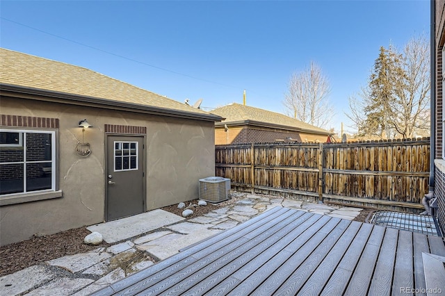 deck featuring a patio area, central AC, and fence