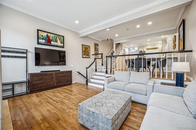 living room with recessed lighting, crown molding, stairway, and wood finished floors