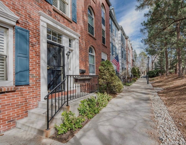 exterior space with brick siding