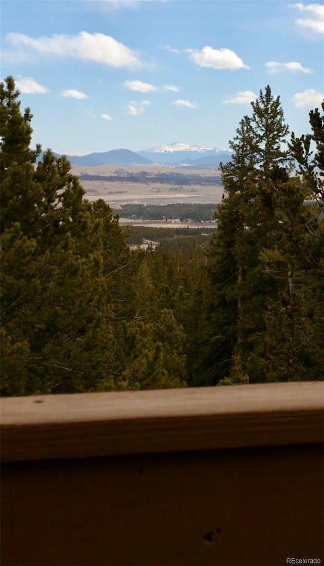 mountain view featuring a view of trees