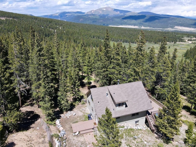 bird's eye view featuring a mountain view and a view of trees