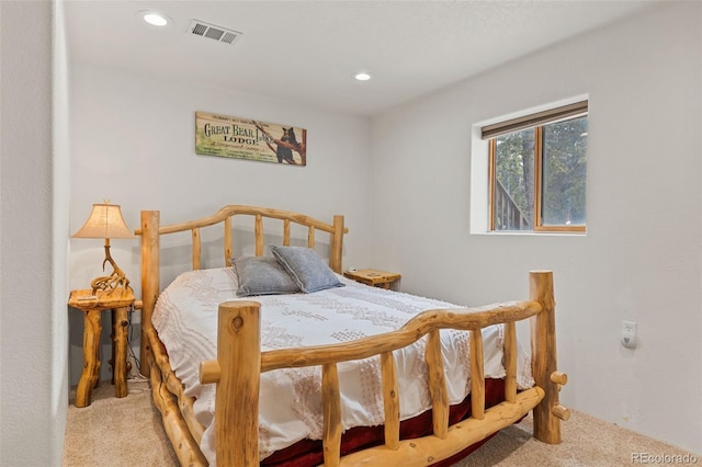 carpeted bedroom featuring recessed lighting and visible vents