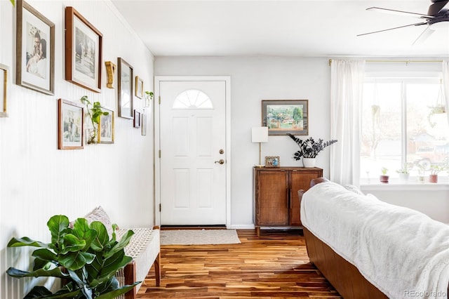 entryway with ceiling fan and hardwood / wood-style flooring