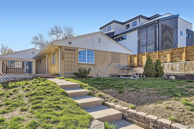 951 Tennyson St, Denver, CO 80204 - view of front of property with brick siding and fence