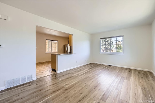 951 Tennyson St, Denver, CO 80204 - unfurnished room with light wood-style floors, visible vents, and baseboards