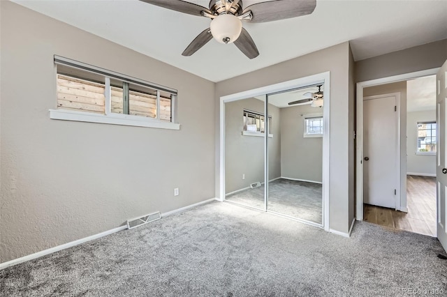 951 Tennyson St, Denver, CO 80204 - unfurnished bedroom featuring carpet floors, baseboards, visible vents, and multiple windows