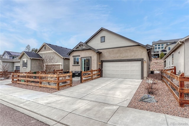 692 Sage Forest Ln, Monument, CO 80132 - single story home with driveway, an attached garage, and stucco siding
