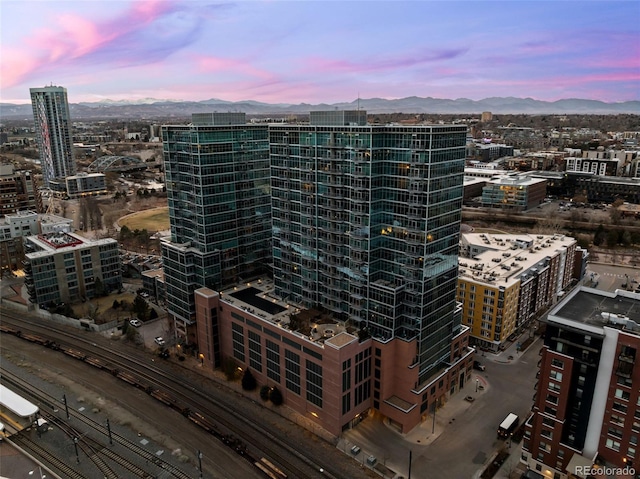 property's view of city featuring a mountain view