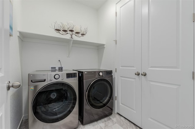 laundry room with washing machine and dryer