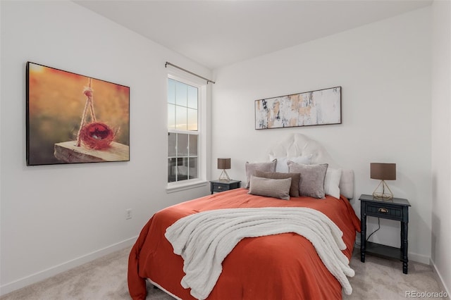 bedroom featuring light colored carpet