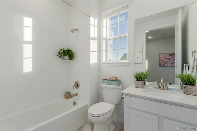 full bathroom featuring vanity, toilet, and tiled shower / bath combo