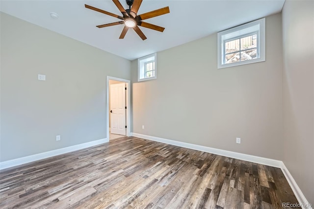 empty room with wood-type flooring and ceiling fan