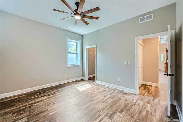 unfurnished bedroom featuring wood-type flooring and ceiling fan