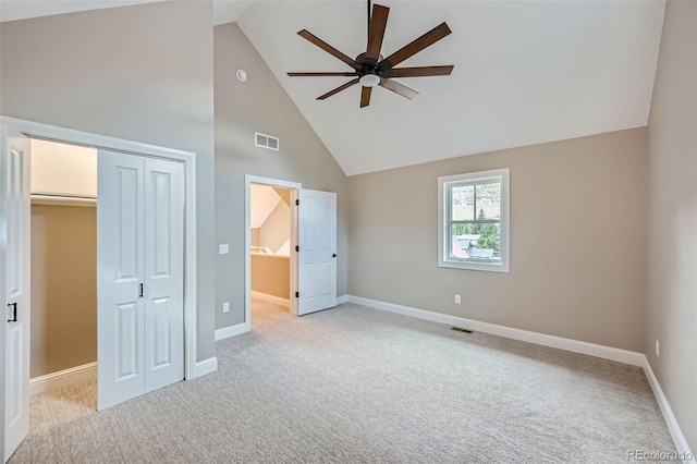 unfurnished bedroom featuring light colored carpet, ceiling fan, and a closet