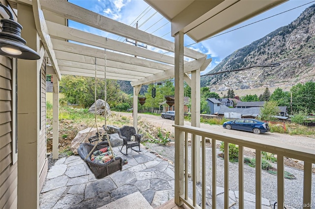 view of patio featuring a mountain view and a pergola