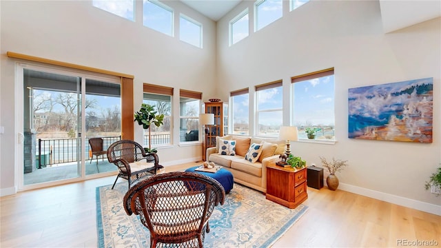 interior space with baseboards and wood finished floors