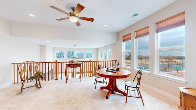 dining room with recessed lighting, baseboards, light carpet, and visible vents