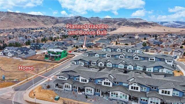 aerial view with a mountain view and a residential view