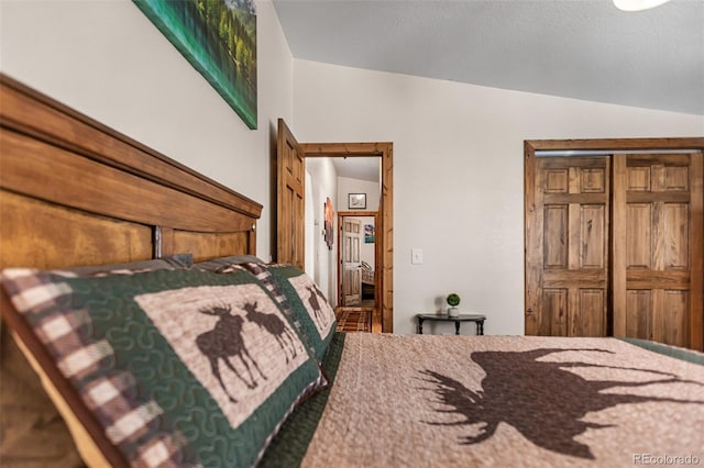 bedroom with vaulted ceiling