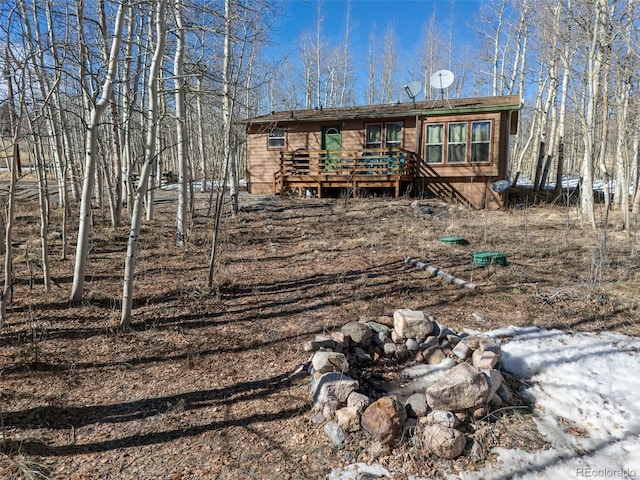 rear view of property with a deck