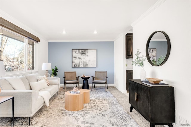 living room with baseboards, crown molding, and light colored carpet