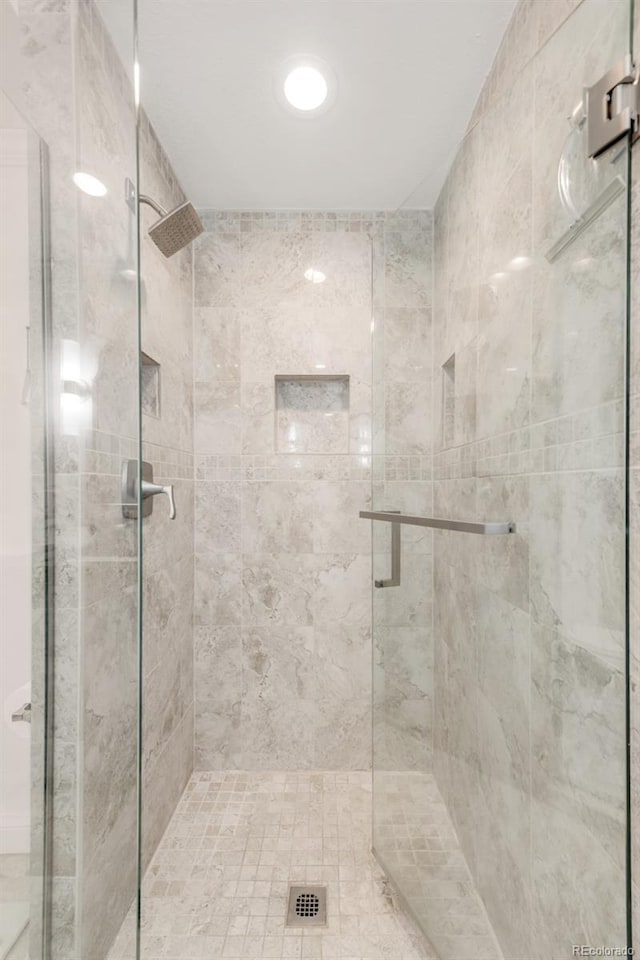 bathroom featuring a shower stall