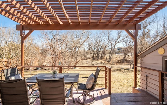 wooden deck with outdoor dining space and a pergola