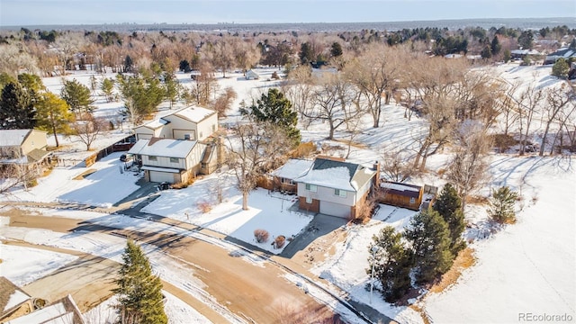 snowy aerial view featuring a residential view