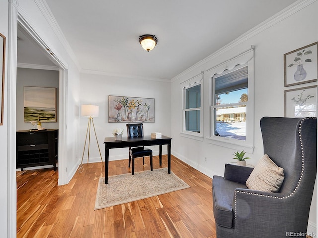 office with wood-type flooring and crown molding