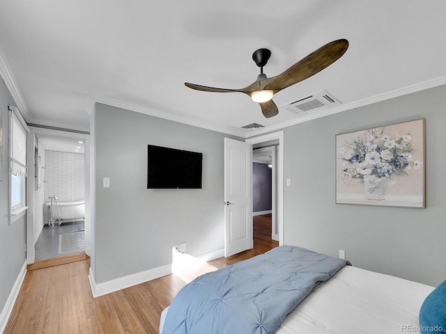 bedroom featuring ceiling fan, light hardwood / wood-style flooring, and crown molding