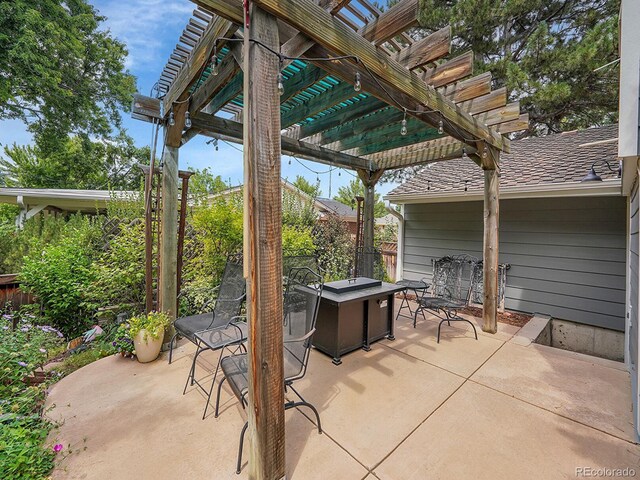 view of patio / terrace featuring an outdoor fire pit and a pergola