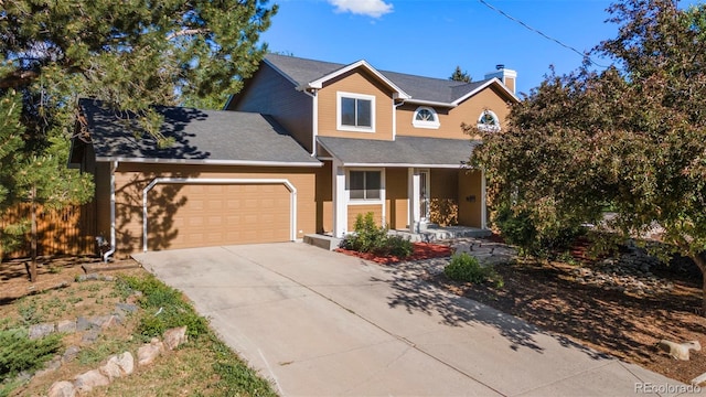 308 Oswego St, Aurora, CO 80010 - traditional-style home featuring covered porch, a garage, driveway, and a chimney
