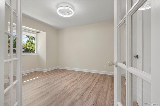 308 Oswego St, Aurora, CO 80010 - unfurnished room with french doors, light wood finished floors, and baseboards