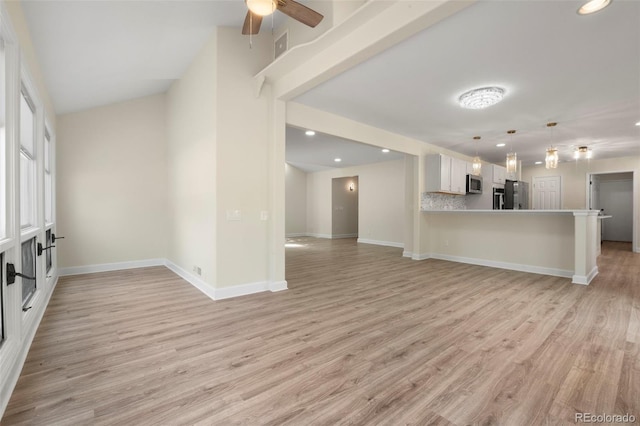 308 Oswego St, Aurora, CO 80010 - unfurnished living room with light wood-style flooring, baseboards, ceiling fan, and recessed lighting
