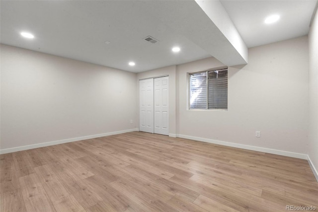 308 Oswego St, Aurora, CO 80010 - unfurnished bedroom with light wood-type flooring, baseboards, recessed lighting, and a closet