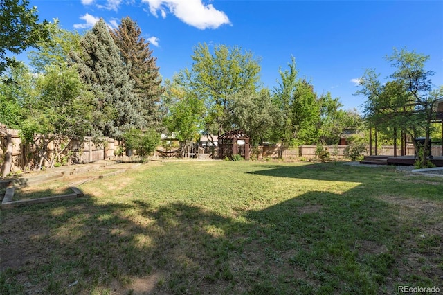 308 Oswego St, Aurora, CO 80010 - view of yard with a vegetable garden