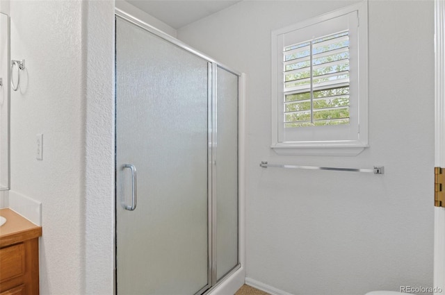 full bath featuring a shower stall and vanity