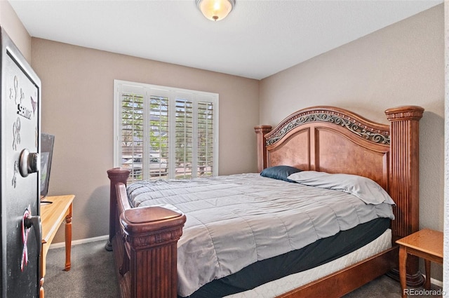 bedroom with carpet flooring and baseboards
