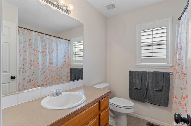 full bathroom featuring vanity and toilet
