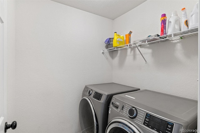 laundry room with independent washer and dryer