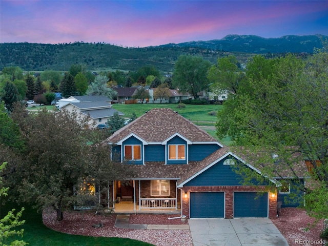 2613 Fox Run Ct, Fort Collins, CO 80526 - view of front of property featuring a porch, driveway, an attached garage, and brick siding