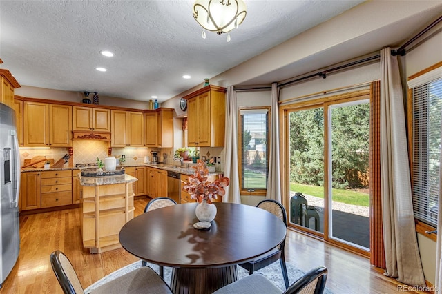 2613 Fox Run Ct, Fort Collins, CO 80526 - dining room with recessed lighting, a textured ceiling, and light wood-style floors