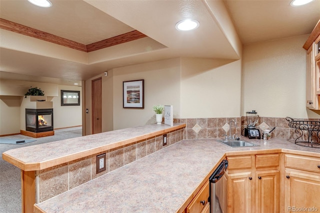 2613 Fox Run Ct, Fort Collins, CO 80526 - kitchen with a sink, carpet floors, recessed lighting, a multi sided fireplace, and a peninsula